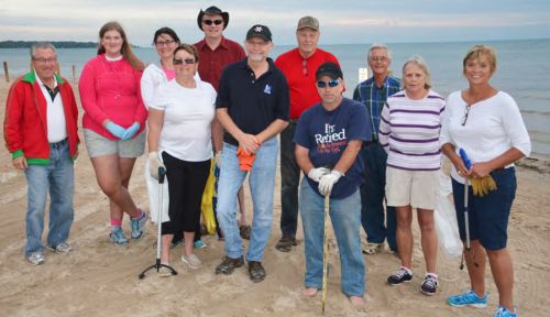 Volunteers and members of the Centre Ipperwash Beach Association take part in a shoreline cleanup, part of the Great Canadian Shoreline Cleanup (Photo by Grace Dekker)